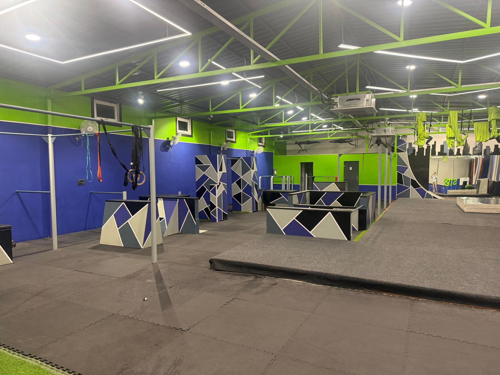 ST8 Fitness training hall — parkour vault boxes and rigs